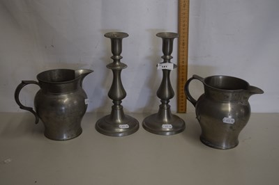Lot 141 - Pair of pewter candlesticks and a pair of...