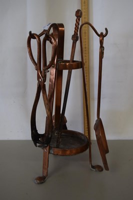 Lot 190 - A copper fire companion set, unsigned