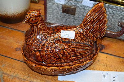 Lot 211 - A Portmeirion brown glazed hen shaped egg...