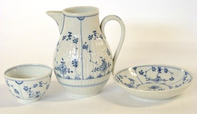 Lot 393 - A continental porcelain jug decorated in...