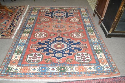Lot 586 - 20th Century Afghan wool rug decorated with a...