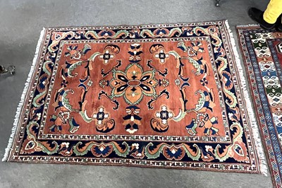 Lot 587 - An Afghan Merino wool rug decorated with large...