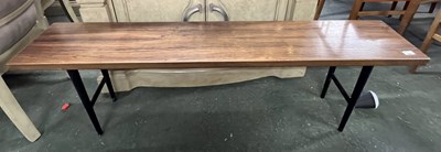 Lot 214 - A mid Century narrow coffee table raised on...