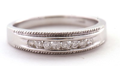 Lot 83 - A 9ct white gold and diamond ring, the upper...