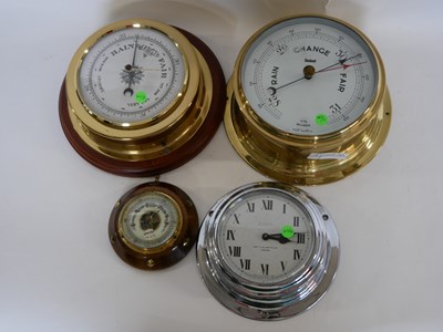 Lot 385 - Group of two brass barometers, one on a wooden...