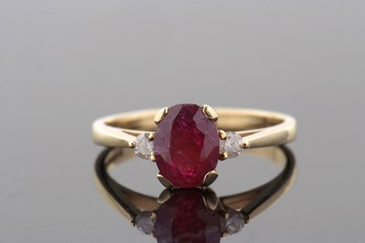 Lot 344 - An 18ct ruby and diamond ring, the treated...