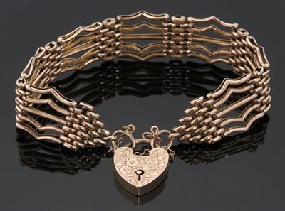 Lot 343 - A '9c' gate bracelet, the satin and textured...