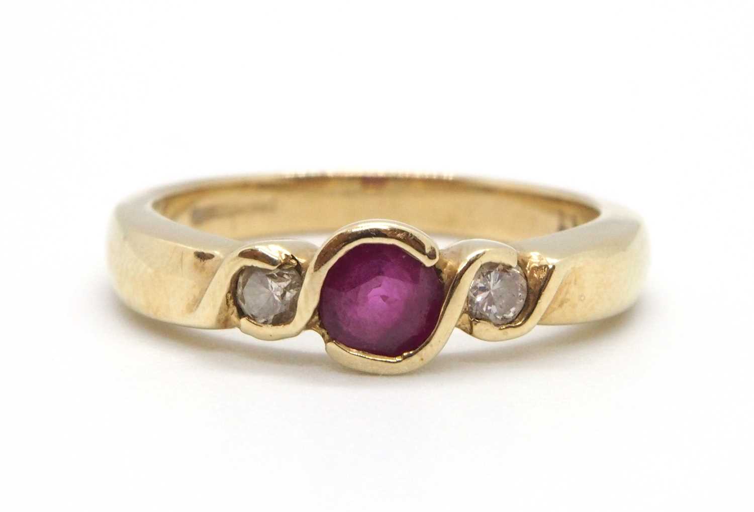 Lot 22 - A 9ct ruby and diamond ring, the round collet...