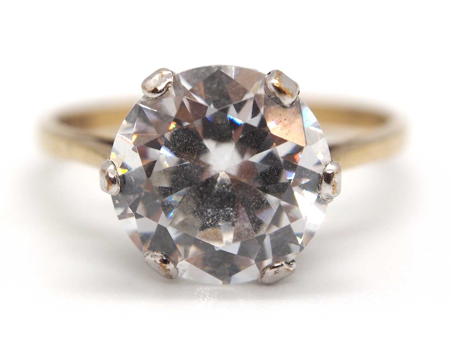 Lot 50 - A 9ct CZ ring, the round claw mounted CZ set...