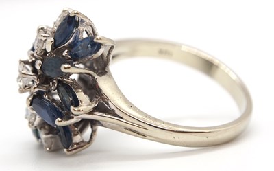 Lot 53 - An 18k sapphire and diamond ring, set with a...
