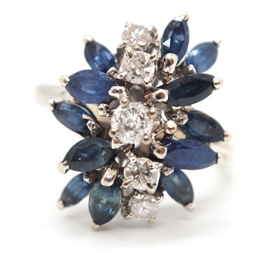 Lot 53 - An 18k sapphire and diamond ring, set with a...