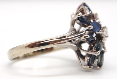Lot 53 - An 18k sapphire and diamond ring, set with a...