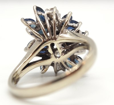 Lot 53 - An 18k sapphire and diamond ring, set with a...