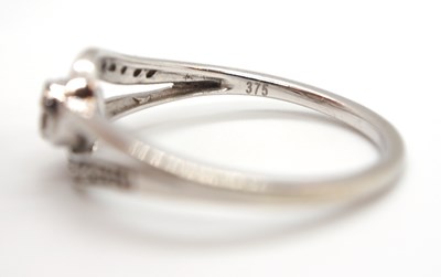 Lot 17 - A 9ct diamond ring, set to centre with four...