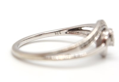 Lot 17 - A 9ct diamond ring, set to centre with four...