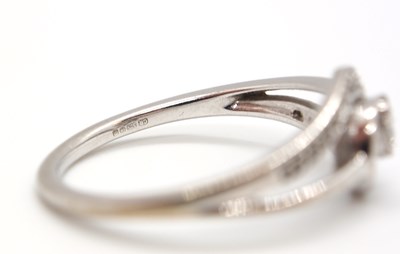 Lot 17 - A 9ct diamond ring, set to centre with four...
