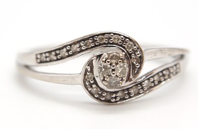 Lot 17 - A 9ct diamond ring, set to centre with four...