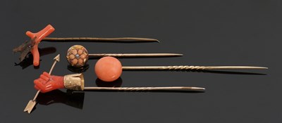 Lot 333 - Four 19th century coral stick pins, to include...