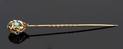 Lot 337 - A turquoise and enamelled egg stick pin, the...