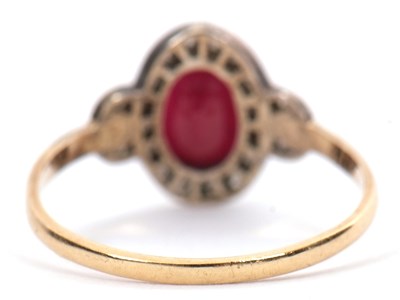 Lot 35 - A 15ct ruby and diamond ring, the oval mixed...
