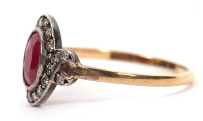 Lot 35 - A 15ct ruby and diamond ring, the oval mixed...