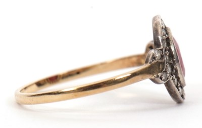 Lot 35 - A 15ct ruby and diamond ring, the oval mixed...