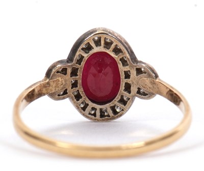 Lot 35 - A 15ct ruby and diamond ring, the oval mixed...