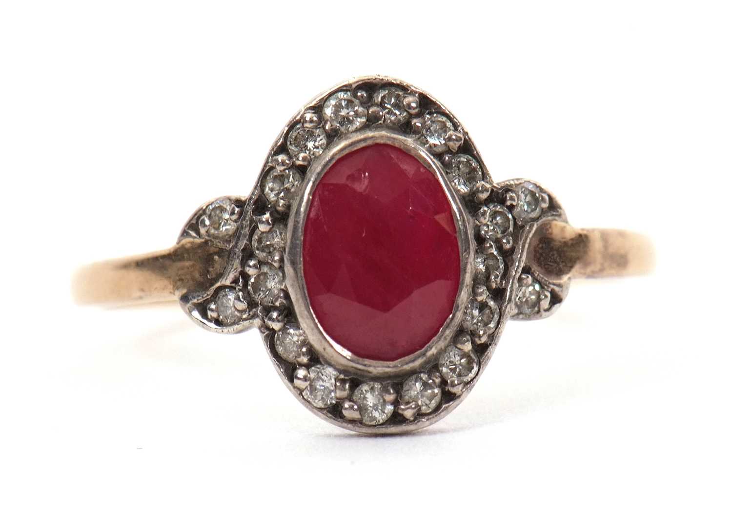 Lot 35 - A 15ct ruby and diamond ring, the oval mixed...