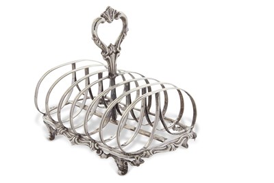 Lot 254 - A Victorian silver toast rack of rectangular...