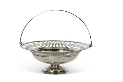 Lot 259 - A George V silver swing handled fruit basket...