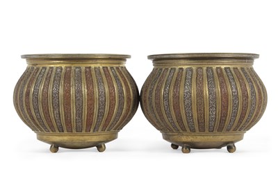 Lot 401 - A pair of Antique Persian bronze and overlaid...