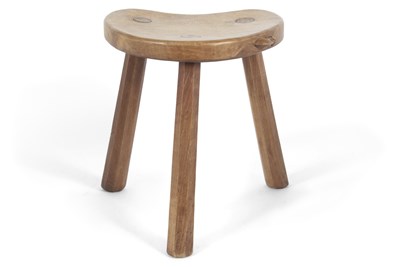 Lot 402 - Robert Mouseman Thompson, an oak milking stool...