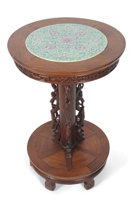 Lot 411 - A Chinese hardwood lamp table with a circular...