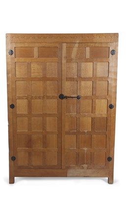 Lot 432 - Robert Mouseman Thompson, a small oak wardrobe...