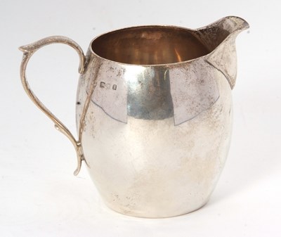 Lot 2 - A George V silver cream jug of bulbous...