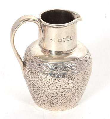 Lot 16 - A Victorian silver small cream jug with plain...
