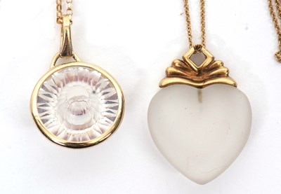 Lot 305 - Two 9ct pendants and chains: to include a...