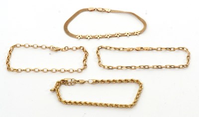 Lot 233 - Three 9ct bracelets and another 9K bracelet:...
