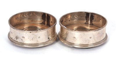 Lot 33 - A pair of Elizabeth II silver and treen bottle...