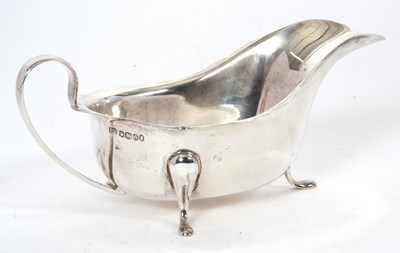 Lot 36 - A hallmarked silver sauce boat of typical form...