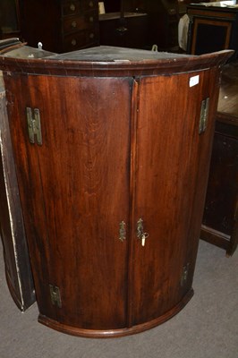 Lot 525 - A George III mahogany bow front two door wall...