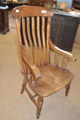 Lot 556 - A Victorian elm seated Windsor style chair...