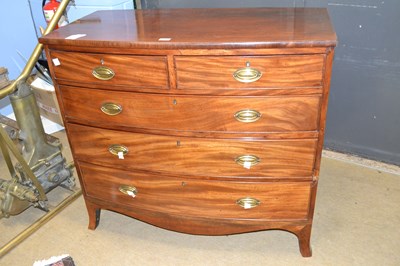 Lot 558 - Georgian mahogany bow front chest of two short...