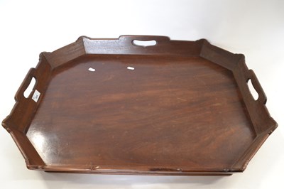 Lot 565 - An octagonal mahogany butlers tray with...
