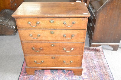 Lot 566 - Small George III oak chest of four graduated...