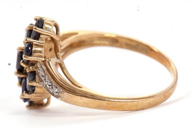 Lot 90 - A 9ct sapphire and diamond cluster ring, with...
