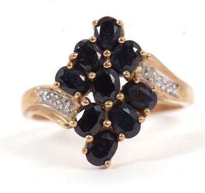 Lot 90 - A 9ct sapphire and diamond cluster ring, with...