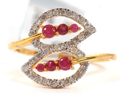 Lot 89 - A 9ct ruby and diamond ring, the two crossover...