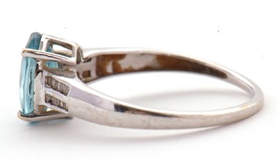 Lot 93 - A 9ct white gold topaz and diamond ring, the...