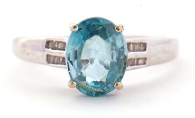 Lot 93 - A 9ct white gold topaz and diamond ring, the...